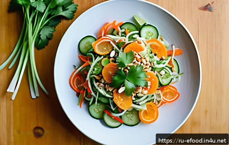 미얀마 샐러드 레파드 - A vibrant Burmese salad displayed on a large flat white ceramic platter, featuring thinly sliced fre...